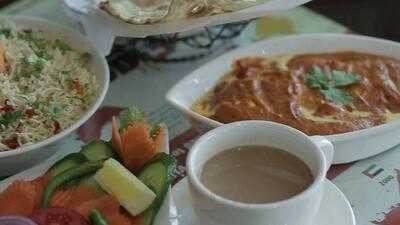 ‪flames Grills & Curry‬