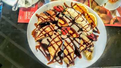 ‪tche Tche Cafe‬