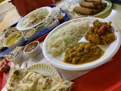 ‪curries & Grills‬