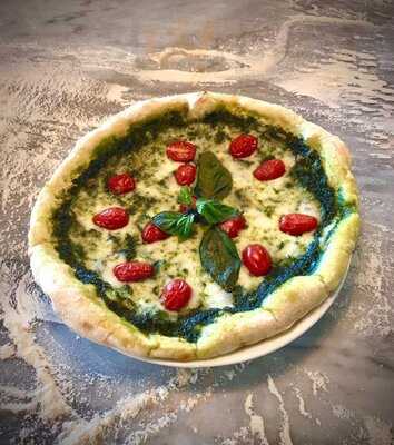 ‪tomato Pizzeria‬