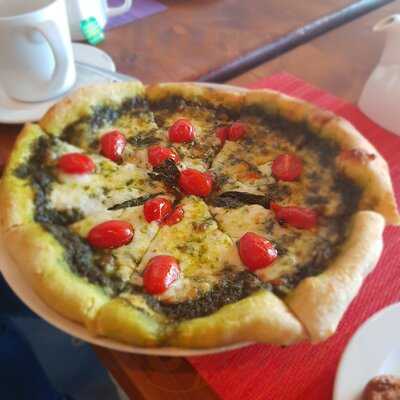 ‪tomato Pizzeria‬