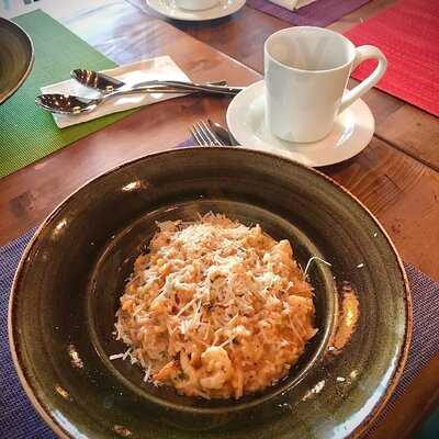 ‪tomato Pizzeria‬