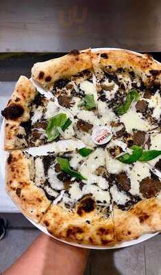 ‪pizza Giuma‬