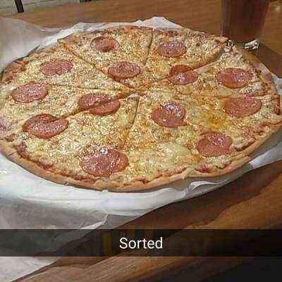 The Mighty Crust Pizzeria