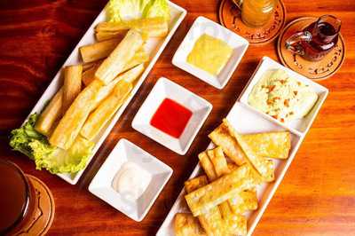 Caliente - Teteria Macerados Y Tapas